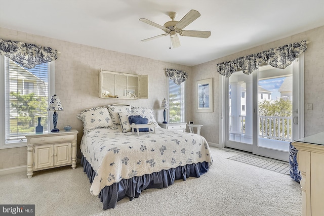 bedroom with light carpet, access to exterior, ceiling fan, and baseboards