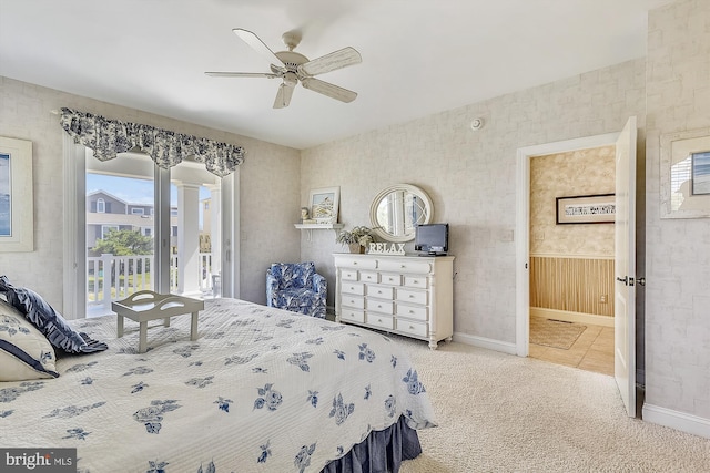 carpeted bedroom with access to outside, baseboards, ceiling fan, and connected bathroom