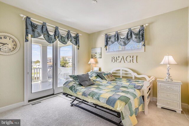 bedroom with ensuite bath, a closet, and carpet floors