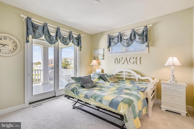 bedroom featuring light carpet, access to exterior, baseboards, and visible vents