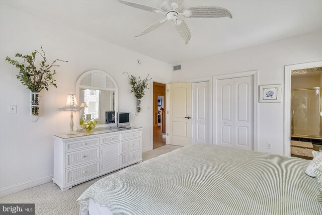 carpeted bedroom with multiple windows and ceiling fan