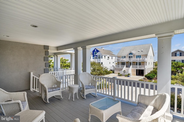 wooden deck with a residential view