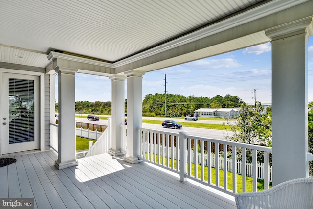 wooden terrace featuring covered porch