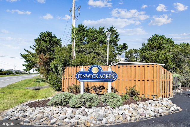 community sign with fence