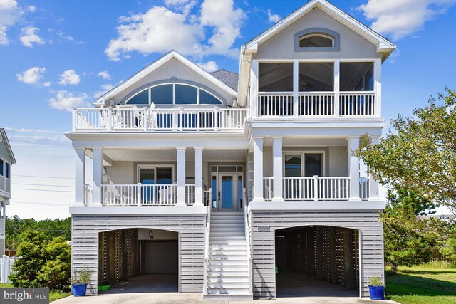 beach home with a balcony and a carport