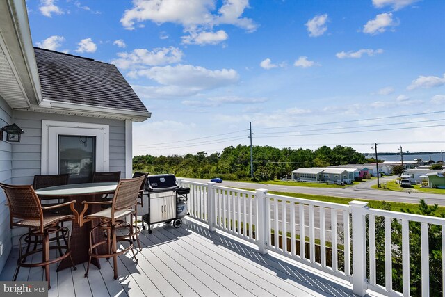 wooden deck with outdoor dining area