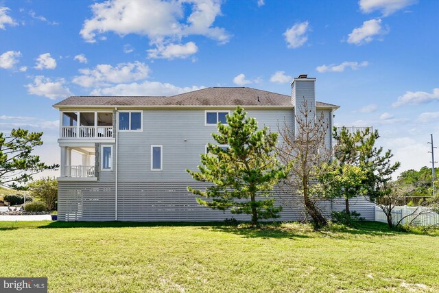 beach home featuring a balcony and a garage