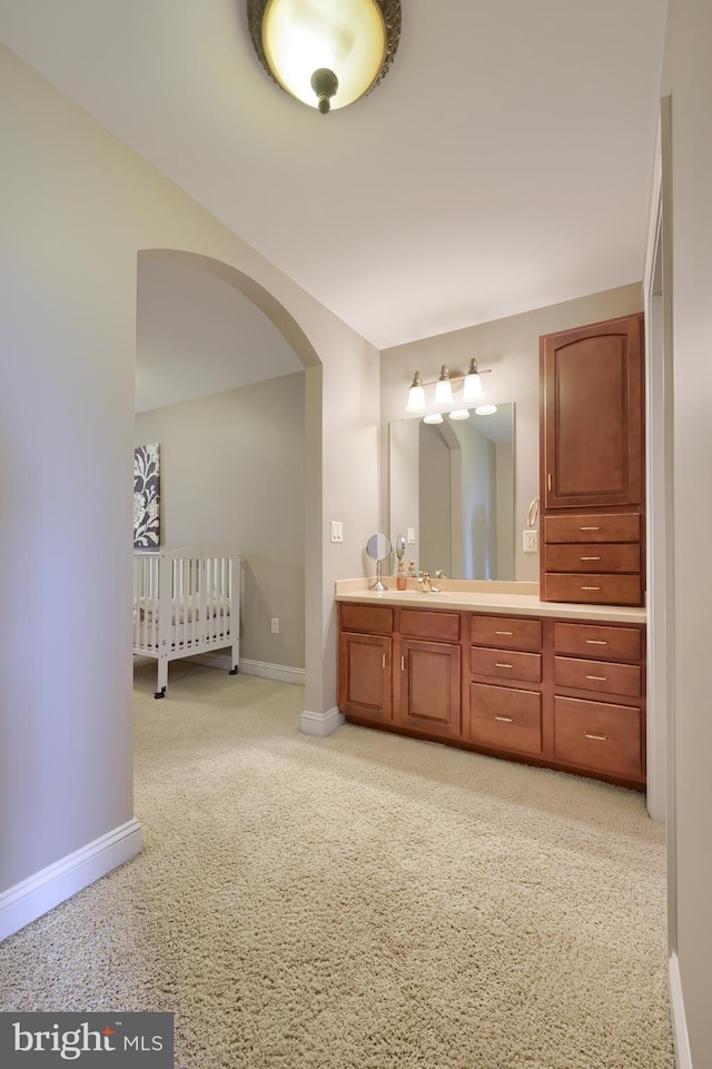 bathroom featuring vanity and baseboards