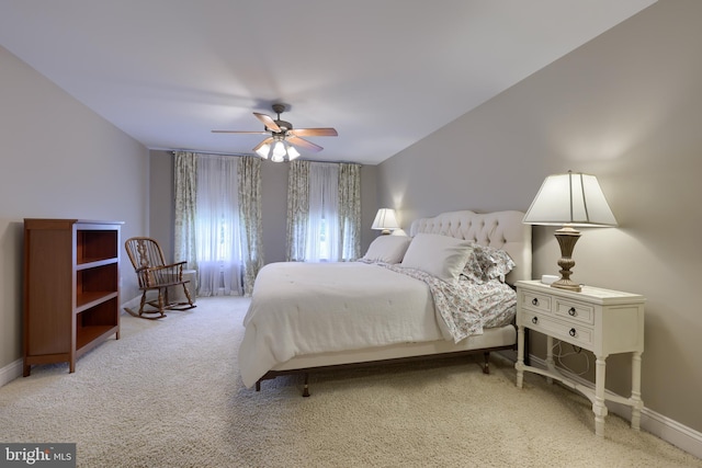 bedroom with ceiling fan, carpet floors, and baseboards