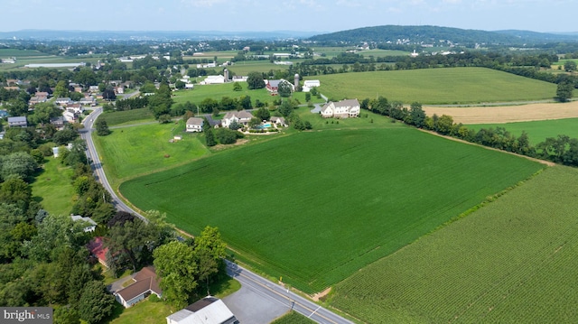 birds eye view of property with a rural view