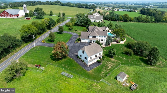 birds eye view of property featuring a rural view