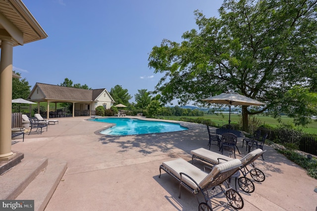 view of pool featuring a fenced in pool, a patio area, and fence