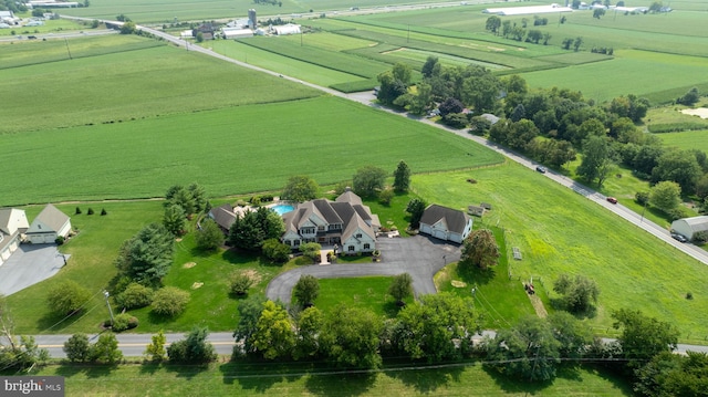 birds eye view of property with a rural view