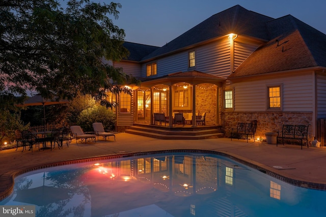 pool featuring a patio area