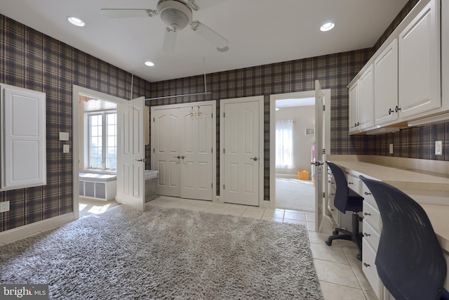 office space with wallpapered walls, light tile patterned flooring, baseboards, and recessed lighting