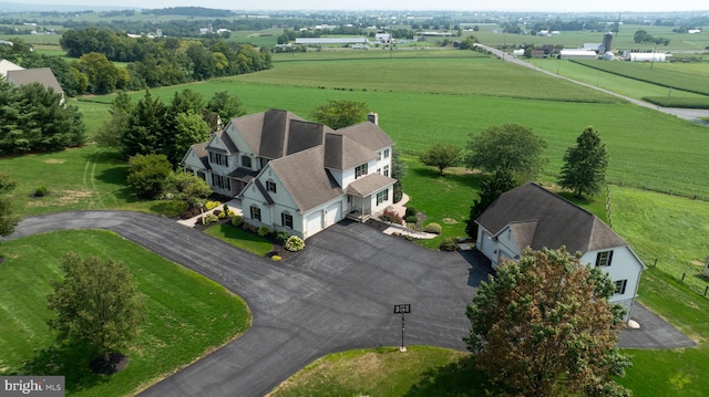 birds eye view of property featuring a rural view