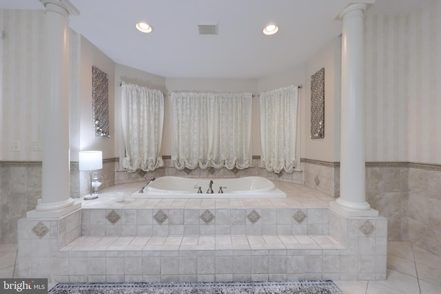 bathroom featuring a bath, recessed lighting, visible vents, and ornate columns