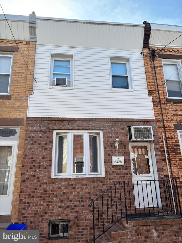 view of front of house featuring cooling unit