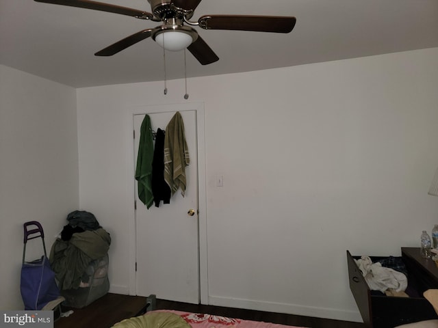 bedroom with ceiling fan and hardwood / wood-style floors