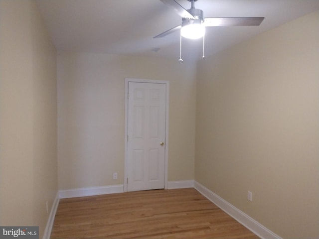 empty room with light wood-type flooring and ceiling fan