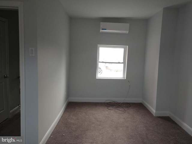 carpeted spare room featuring a wall mounted AC