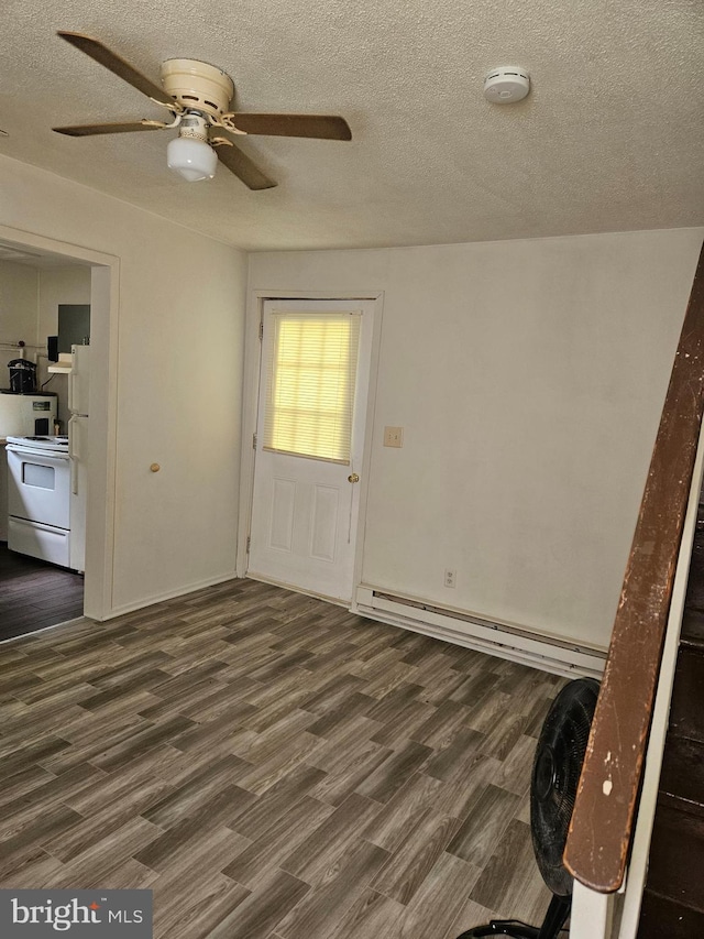 interior space featuring ceiling fan, a textured ceiling, and dark hardwood / wood-style floors