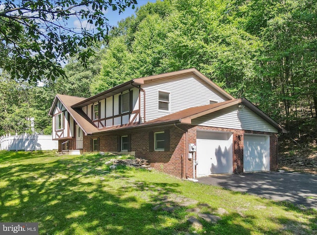 exterior space with a garage and a yard