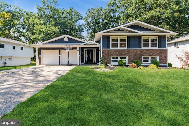 split level home with a garage and a front yard