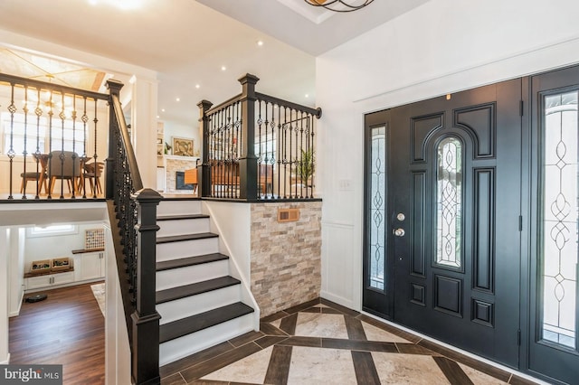 foyer with dark hardwood / wood-style floors