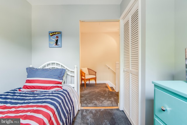 carpeted bedroom with a closet