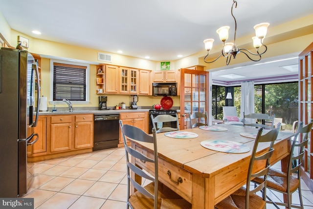 tiled dining room featuring sink and a notable chandelier