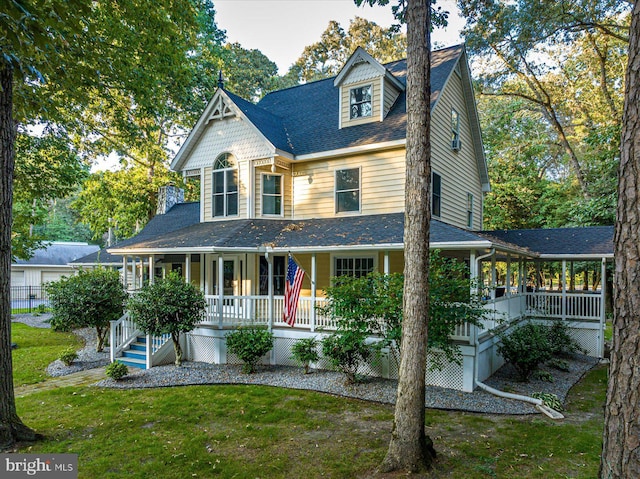 view of front of home featuring a front yard and a porch