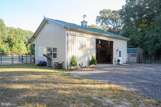 exterior space with a lawn and an outdoor structure