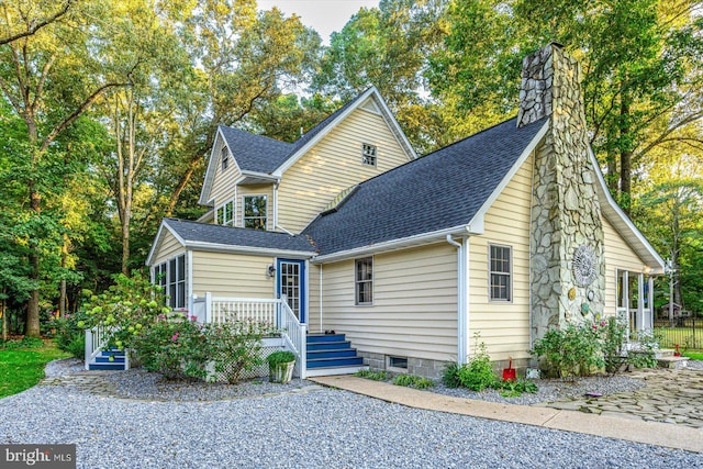 view of front of house featuring a sunroom