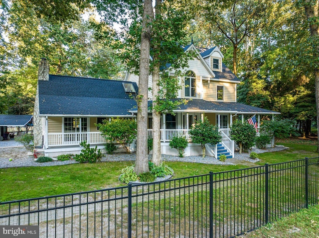 view of front of property with a front yard and a porch