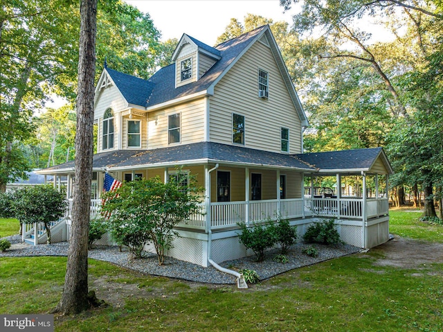 exterior space with a front yard and covered porch