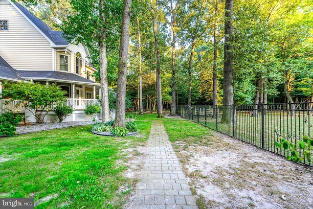 view of yard with covered porch