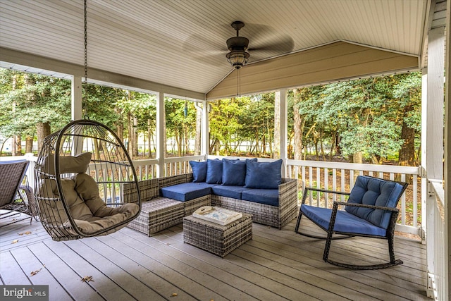 sunroom / solarium featuring ceiling fan and lofted ceiling