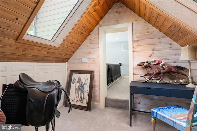 bedroom featuring wooden walls, wooden ceiling, carpet flooring, and vaulted ceiling with skylight