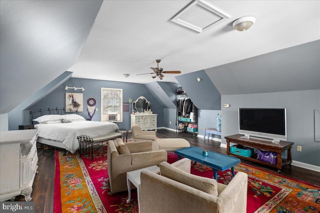 bedroom featuring ceiling fan, cooling unit, dark hardwood / wood-style flooring, and vaulted ceiling