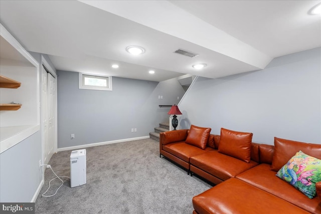 living room featuring light colored carpet and vaulted ceiling