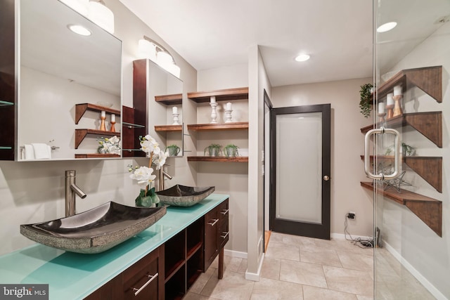 bathroom with tile patterned flooring and vanity