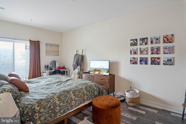 bedroom featuring dark wood-type flooring