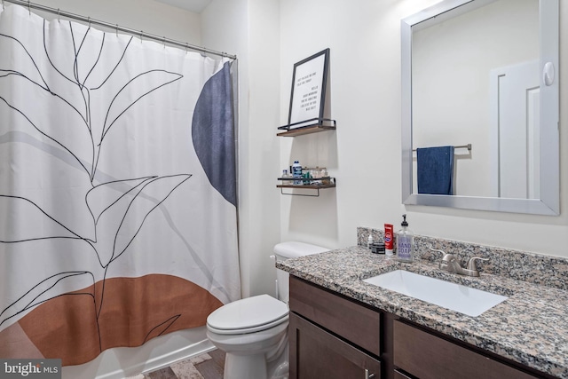 full bathroom with vanity, shower / bath combination with curtain, and toilet