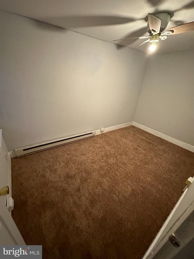 empty room featuring a baseboard radiator, carpet floors, and ceiling fan