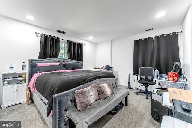 bedroom featuring light carpet