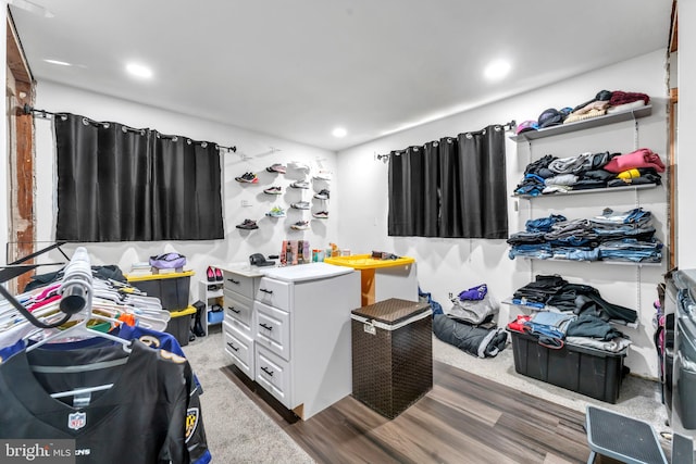 spacious closet with dark hardwood / wood-style floors