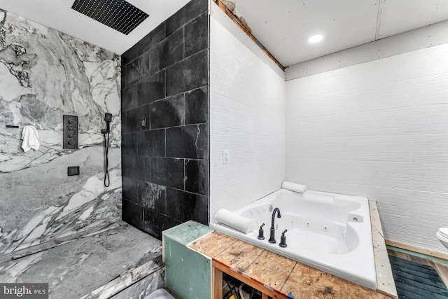 bathroom with tile walls and a tile shower