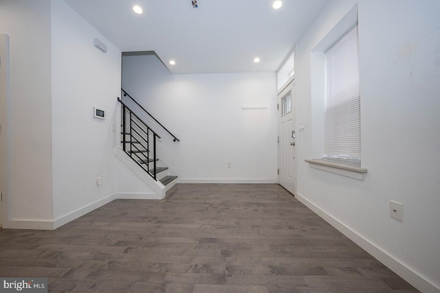 entryway with dark hardwood / wood-style floors