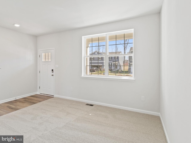 empty room with carpet flooring